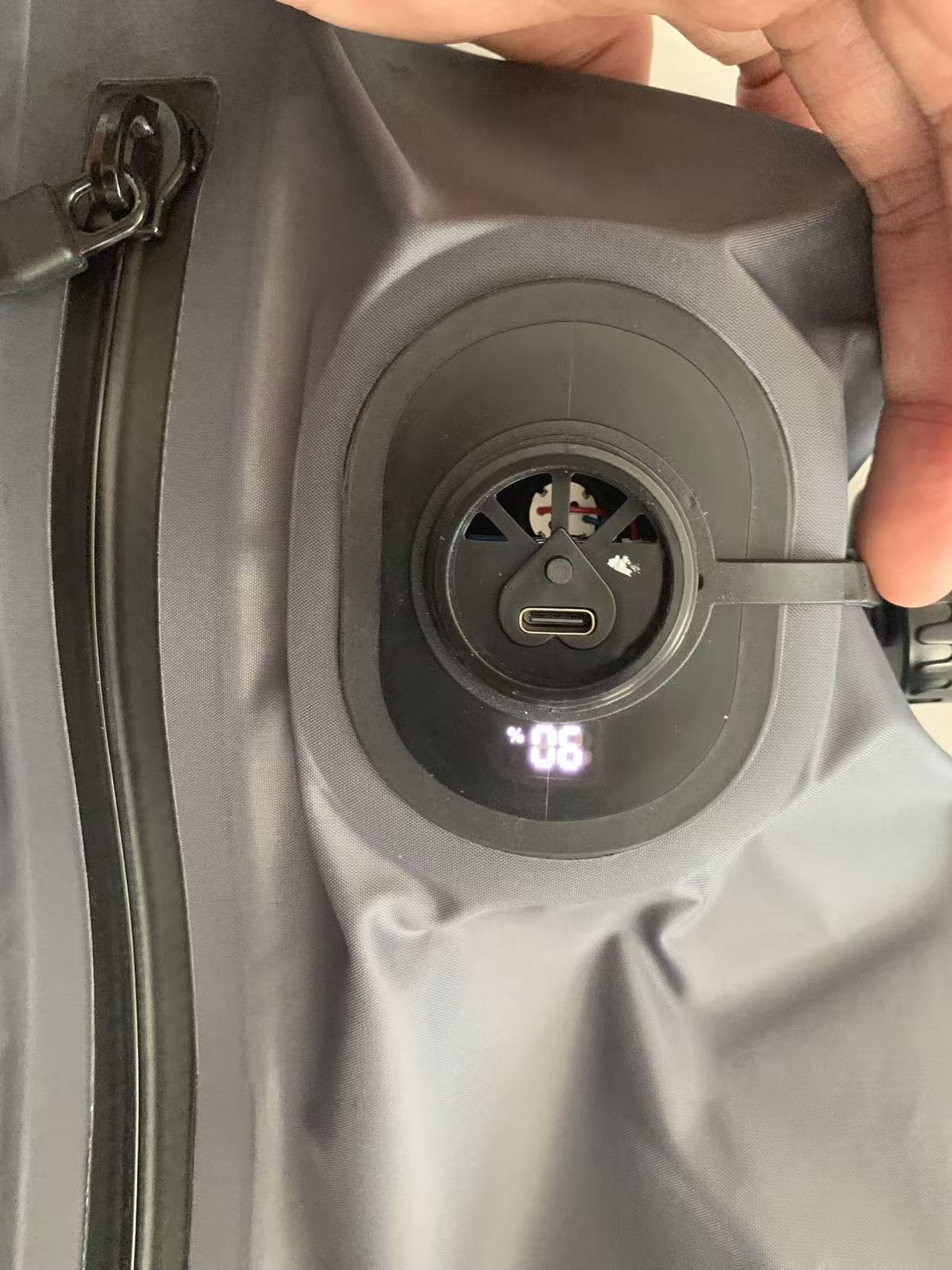 built-in rechargeable pump with digital display on compression bag